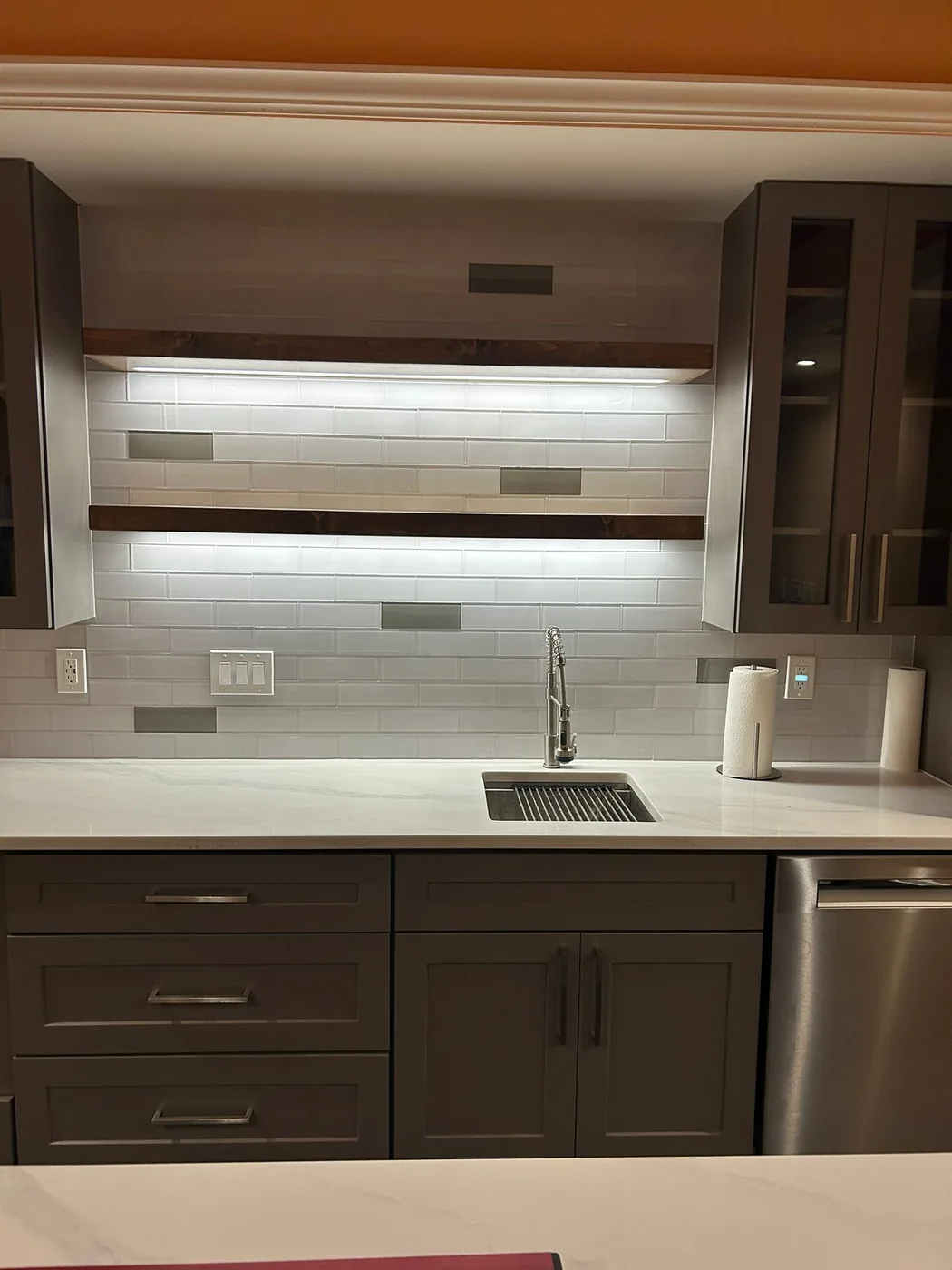 Finished sink, backsplash and storage in a Johns Creek basement