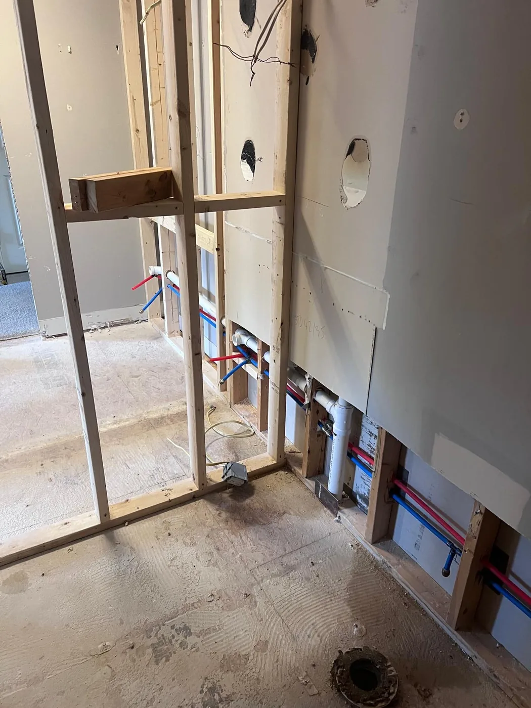 Bathroom plumbing rough-in during remodeling project in Milton GA