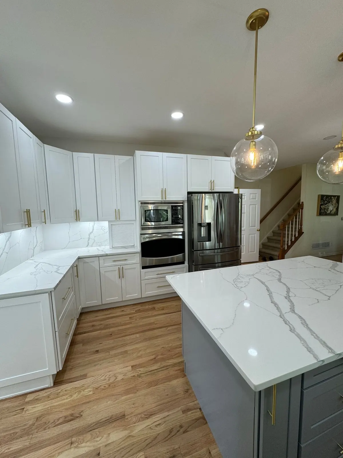 Bright white kitchen remodel with quartz island in Roswell, GA