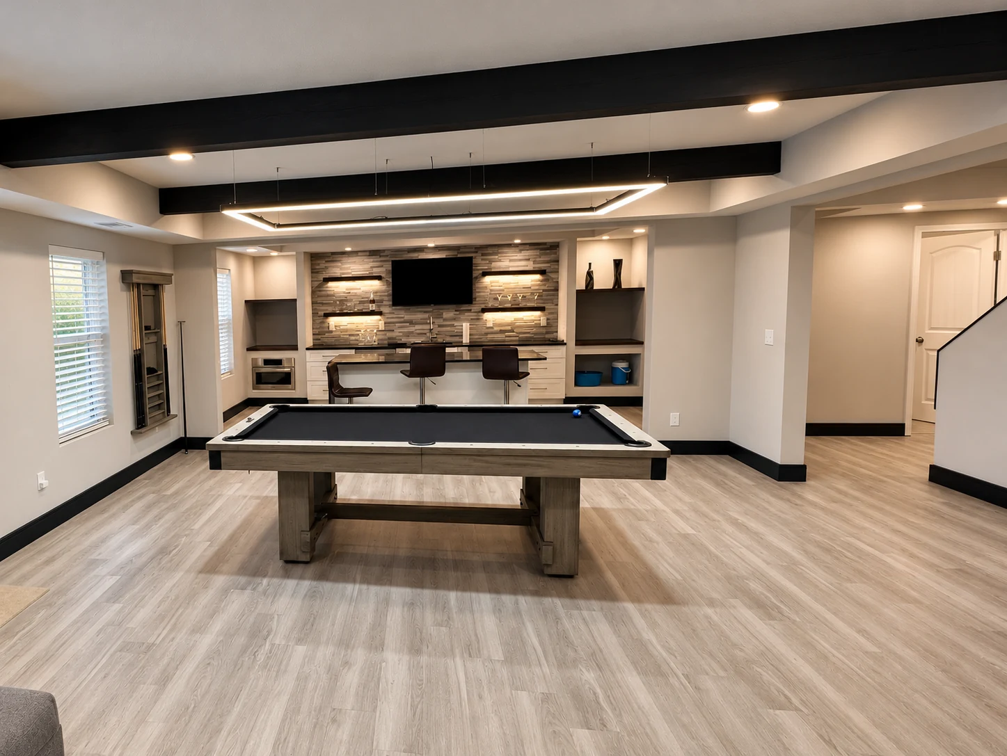 Custom basement bar with seating and modern finishes