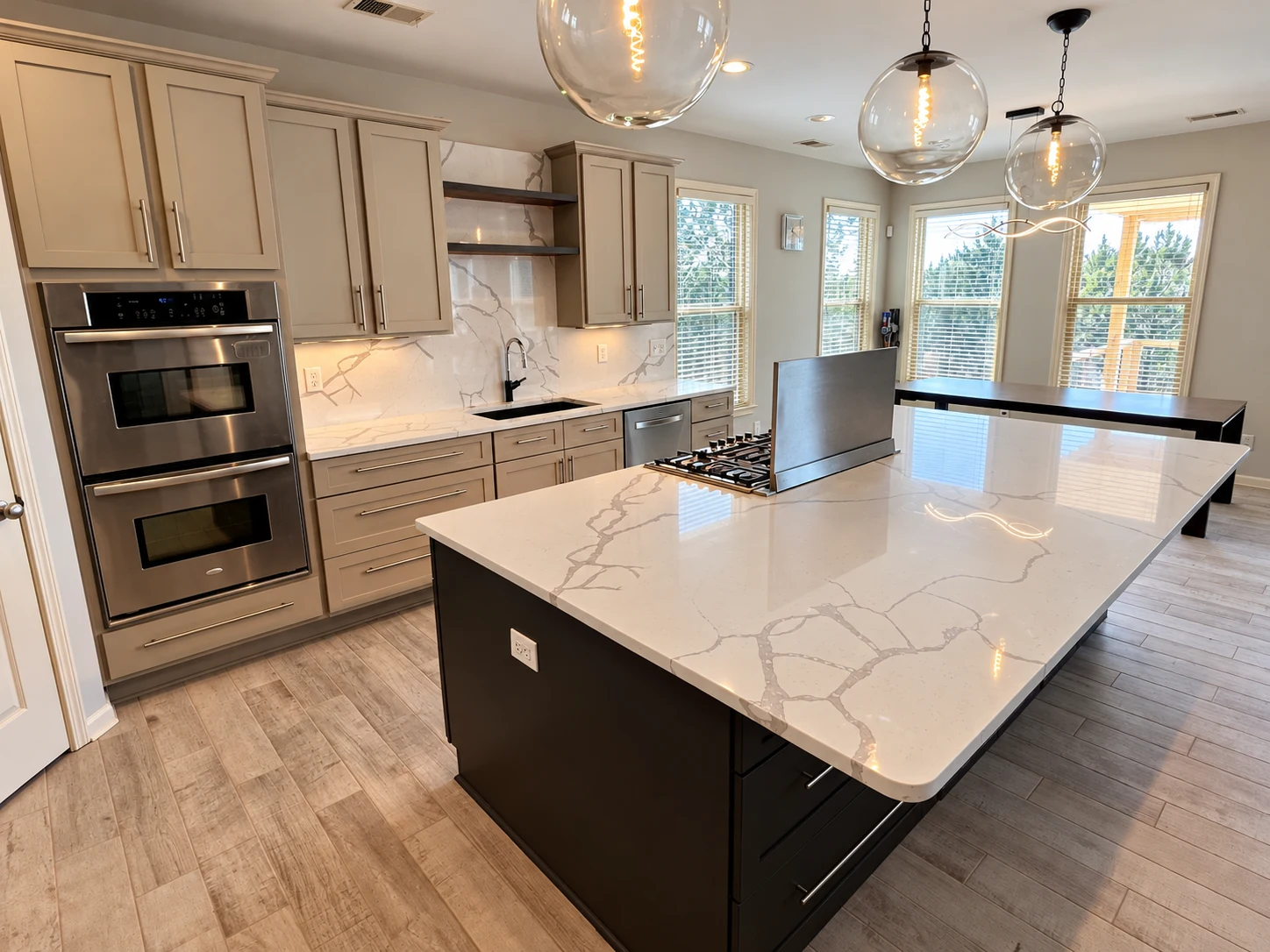 Custom kitchen with quartz countertops and pendant lighting
